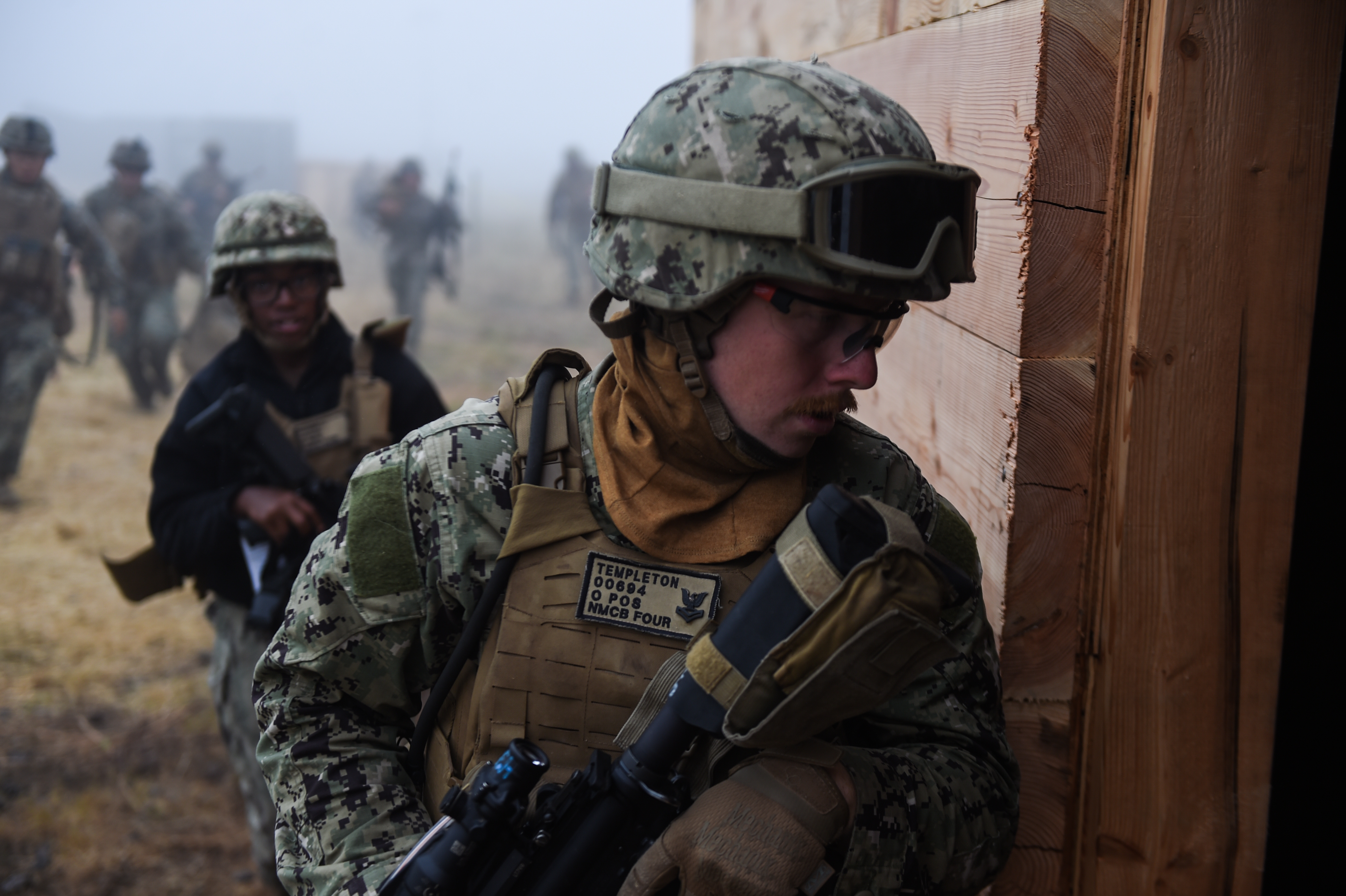 This is an image of a Sailor participating in a simulated indirect fire exercise.